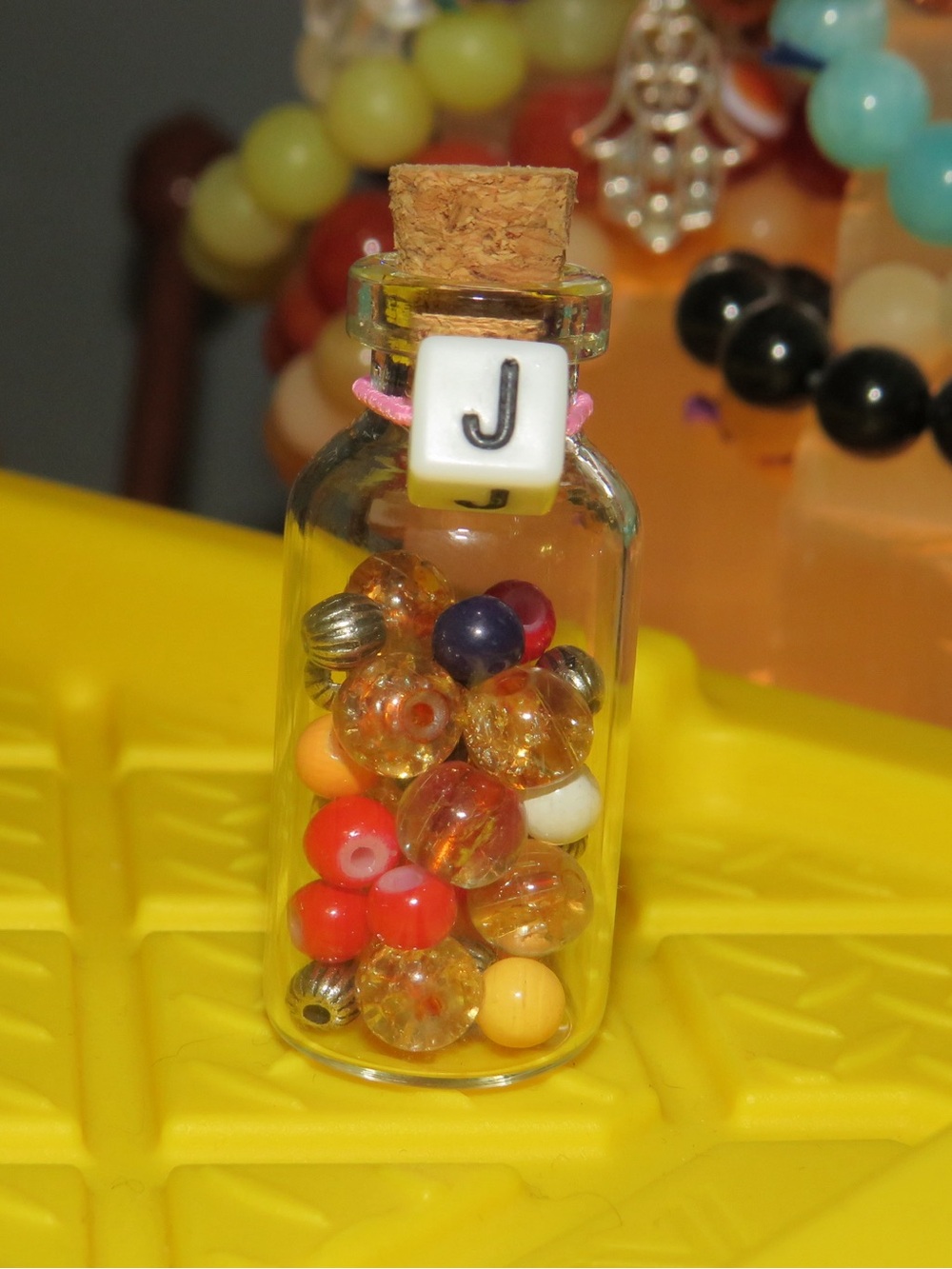 Initial J potion bottle